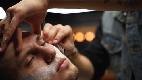 Man Getting Eyebrows Styled Close Up