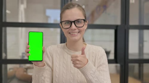 Positive Woman Holding Green Chroma Key Smartphone Screen
