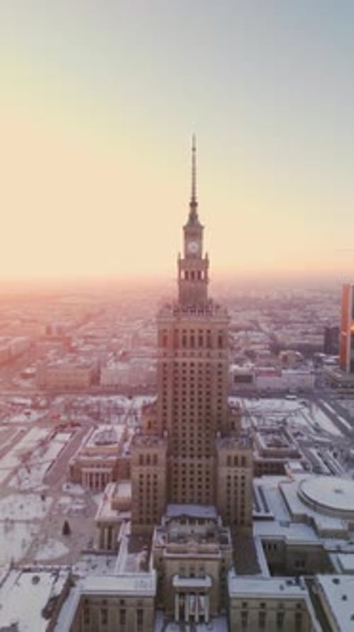 vertical Aerial winter view of the Palace of Culture and Science in Warsaw at sunset