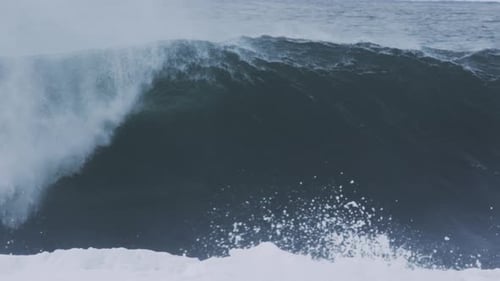 Huge Ocean Wave Cresting and Breaking