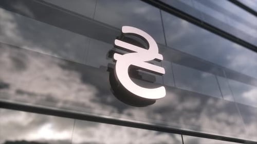 Ukrainian hryvnia symbol currency sign on a modern glass skyscraper