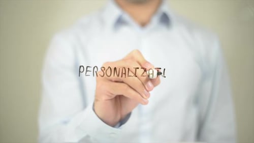 Man Writes Personalization on Clear Surface
