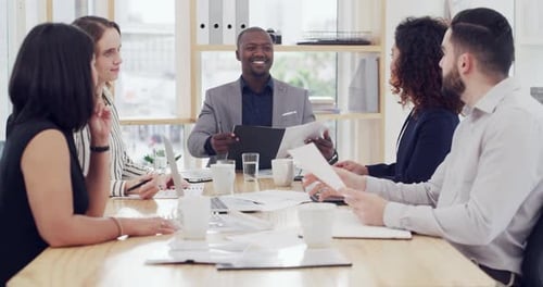 4k video footage of a diverse group of businesspeople sitting and having a meeting in the office