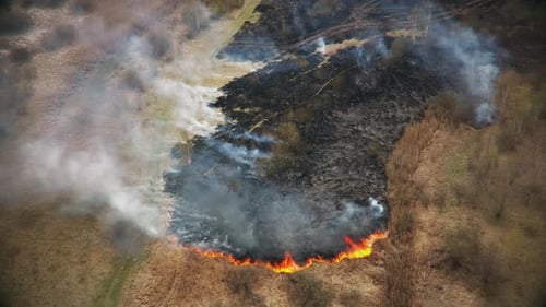 Aerial View of Fire Burning in a Field
