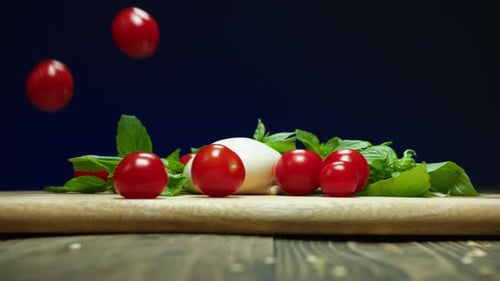 Red Cherry Tomatoes Fall Down Onto Wooden Table Slow Motion