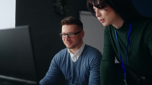 Male and Female Engineers Communicating in Office Discussing Project in Computer Office Workers