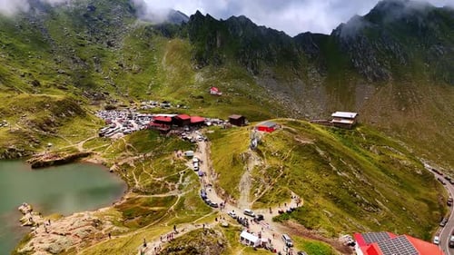 Approaching the group of buildings and parking lot in the mountains.