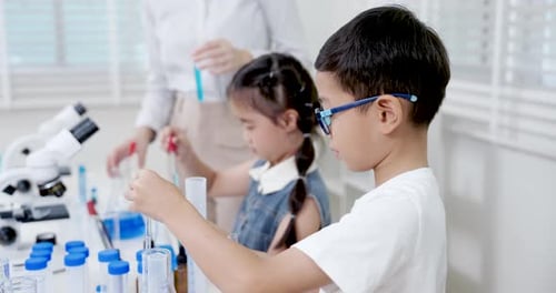 Young Scientists Experimenting in a Laboratory Setting