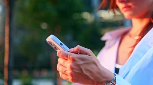 Happy Beautiful Girl Young Business Woman Walking in City Street Looking Into Mobile Phone