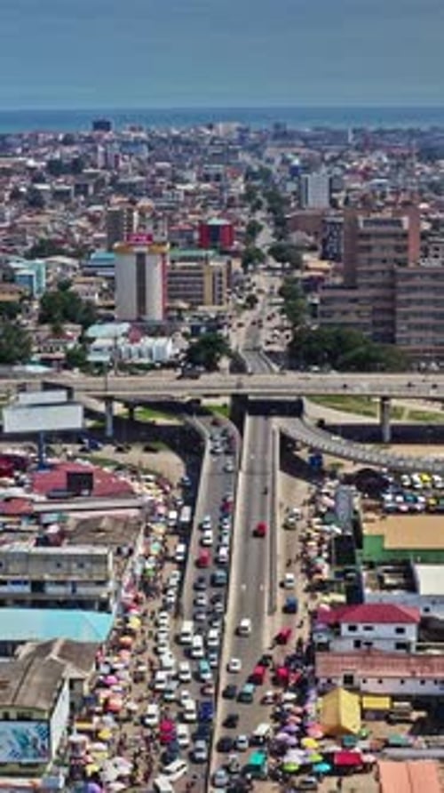 Aerial view of bustling traffic and markets in Accra, Ghana