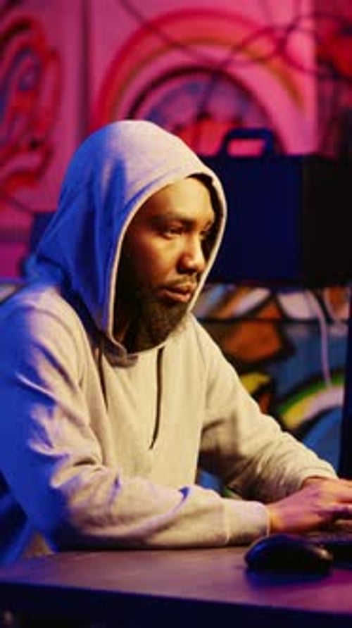 Man Working at Computer at Night