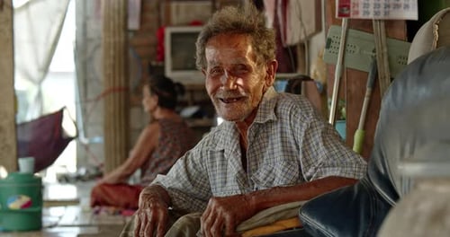 Elderly Man Smiling in His Home