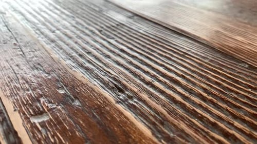 Review of an empty old wooden tabletop. Aged rustic wooden background. Dark brown wood with light ag