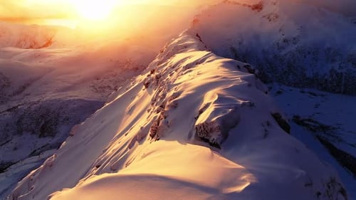 Winter Mountain Range Snowcovered Peaks Cold Sunset or Sunrise Golden Hour Inspiring Natural