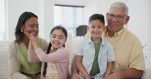 Smiling Family Poses Together Indoors