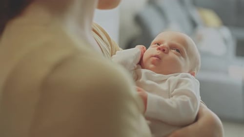 Baby boy lookng at his mother