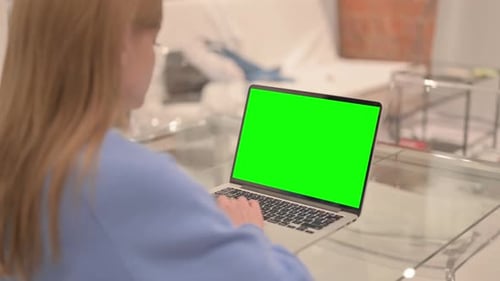 Businesswoman Using Laptop with Green Screen