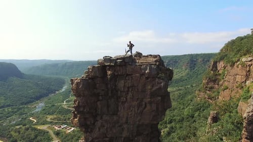 Young free climber conquers mountain cliff at sunset in beautiful South Africa