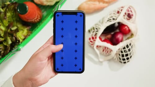 Food Shopping Delivery Online Shop Application Smartphone with Blue Chroma Key Screen and Fresh