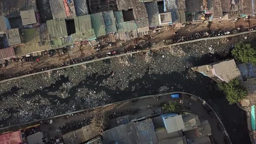 Top Down Aerial View on Filthy Canala With Garbage in Dharavi Slum, Mumbai, India