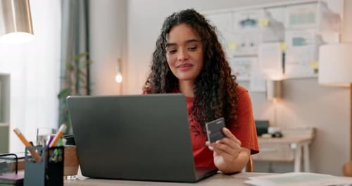 Woman Using Credit Card at Computer in Home