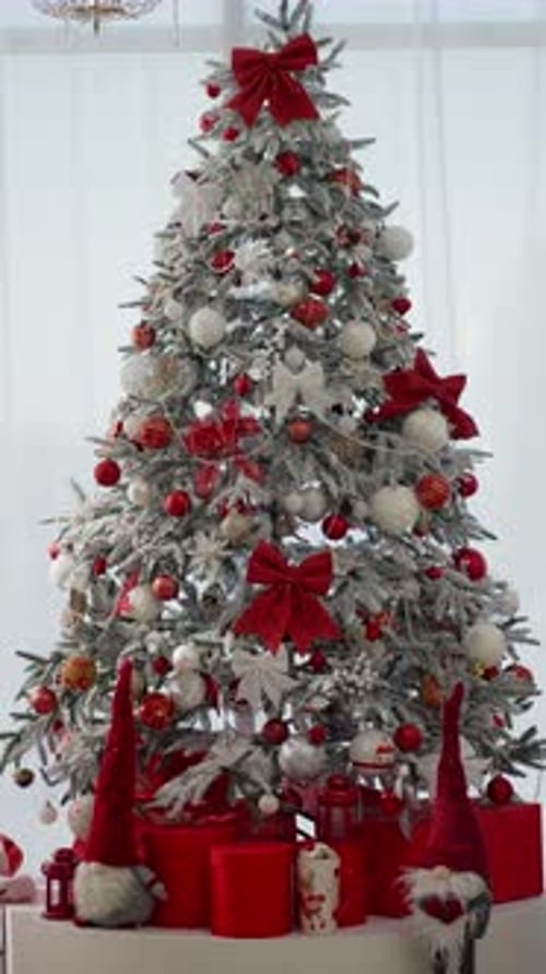 Decorated Christmas Tree with Red Ornaments and Gifts