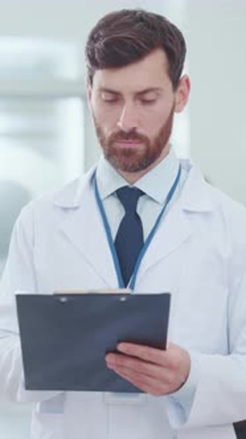 Medical Professional with Clipboard in Hospital Setting