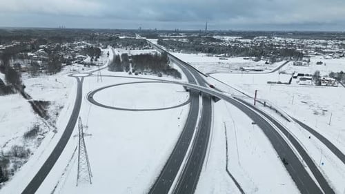 An Aerial View Capturing the Serene Snow Covered Highway Interchange Set in a Beautiful Winter