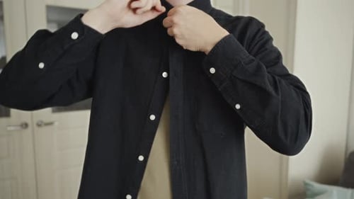 Closeup of Man Fastening Top Button Before Office Work