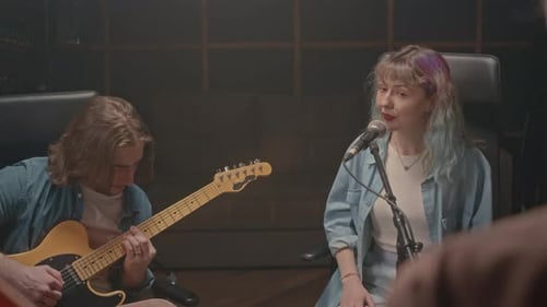 Music Duo Recording Song at Sound Studio