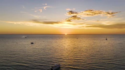 Aerial View of White Yachts at Sunset Floating on Sea Waves with Ripple Surface