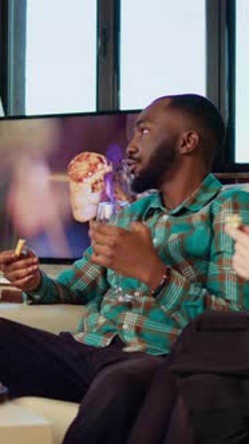 Vertical Video Multiethnic Guests Having Brunch Together Consuming Snacks in Living Room