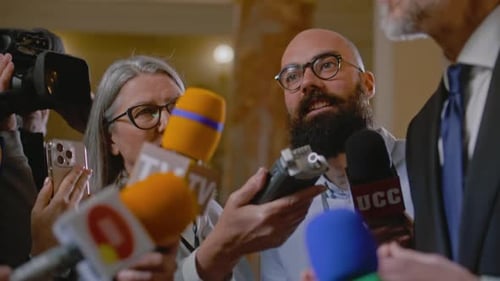 Reporters Asking Questions at a Press Conference