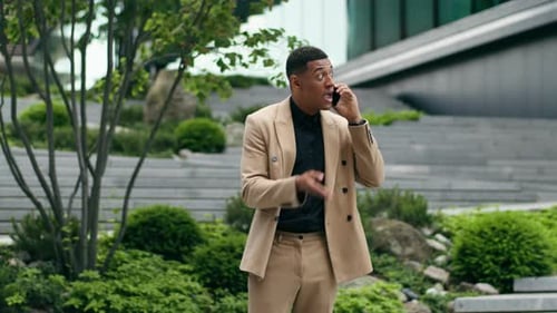 Angry African American Business Man Talking on Mobile Phone in City Downtown Frustrated Mad