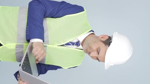 Vertical video of Engineer waving at camera.