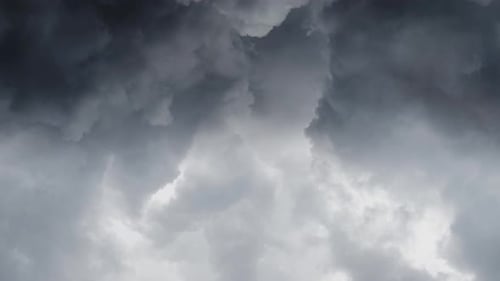 view of thick clouds and storm on dark sky.