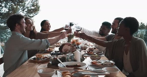 Friends Raise Wine Glasses for Festive Outdoor Toast