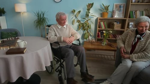 Seniors Enjoying Conversation during Group Portrait in Nursing Home