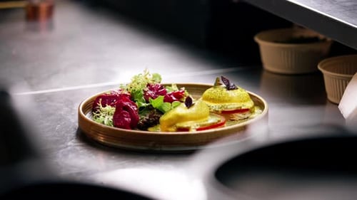 Close Up in a Professional Kitchen on a Clean Metal Table in a Wooden Round Plate a Beautifully