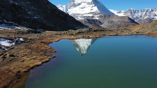 Matterhorn peak reflects in Stellisee Lake in Zermatt, Switzerland.Perfect Sunny day, clear sky. Asc