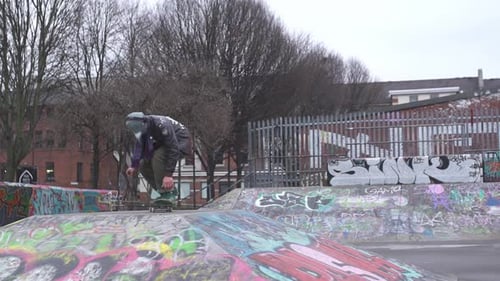 Skateboarding in slow motion at an urban skate park