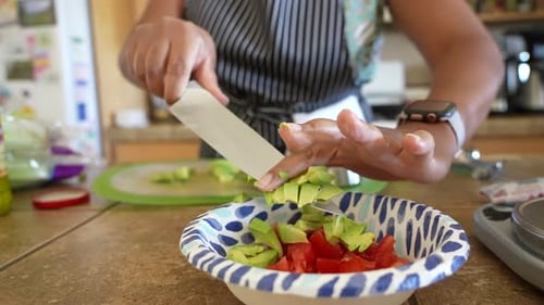 Dicing fresh, organic avocado for a chopped salad - ANTIPASTO SALAD SERIES