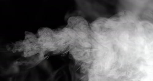 Ethereal smoke trails dance across a black void in super slow motion phantom flex 4k
