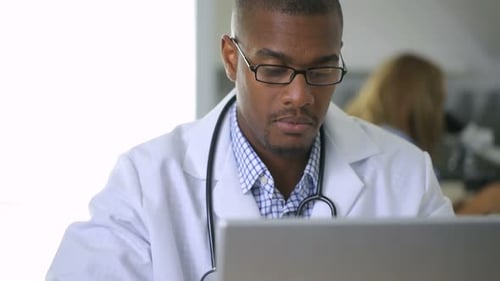 Doctor Examining X-ray in Clinic