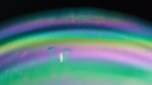 Multicolored surface of a soap bubble in macro