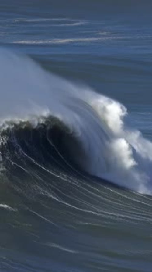 Large Wave Rolling on Surface of Stormy Ocean