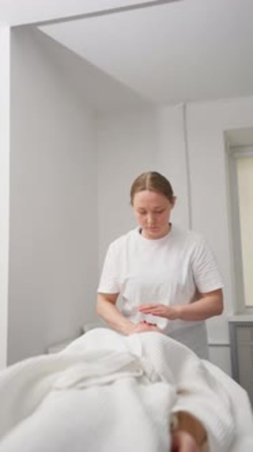 Woman Receiving a Relaxing Facial Massage