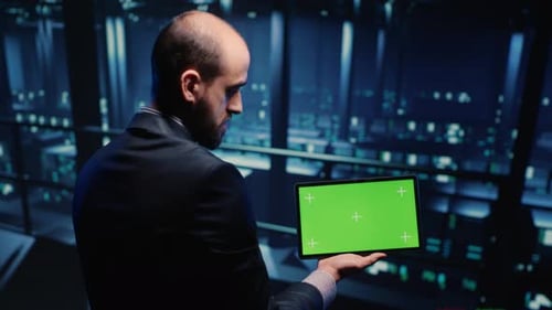 Professional Server Engineer Using Greenscreen on Tablet