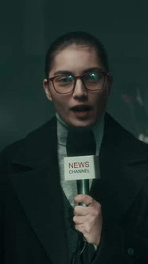 Young Woman Broadcasting With News Channel Microphone