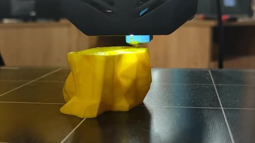 3D Printer Working Closeup 3D Printer Prints Model From Molten Yellow Plastic